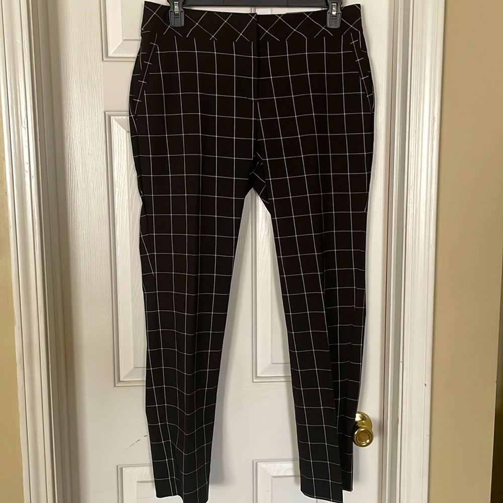 Black and white slim leg, ankle length pants.